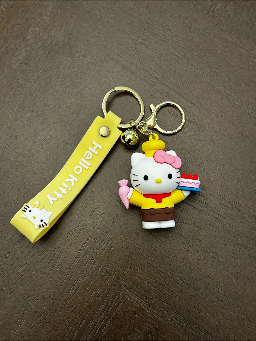 Hello Kitty Yellow Chef Keyring with Pink Bow and Cake Accent